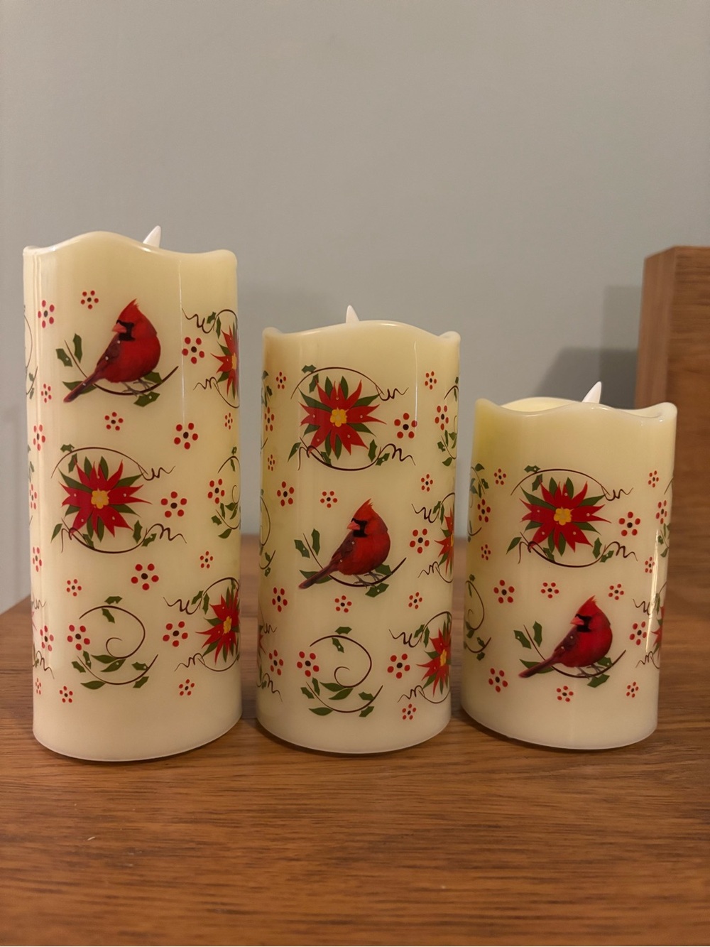 Temp-tations by Tara Christmas pattern of red cardinals and poinsettias candles